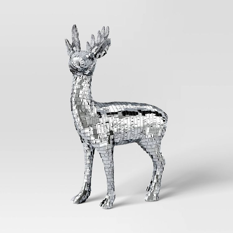 A reindeer made of mirror, like some kind of disco ball halucination.